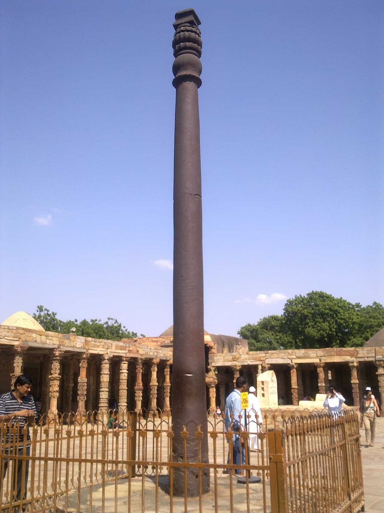 The Iron Pillar of Delhi in the courtyard of the Quwwat-ul-Islam mosque. Seven metres tall, six tonnes, 1,600 years old, unrusted.