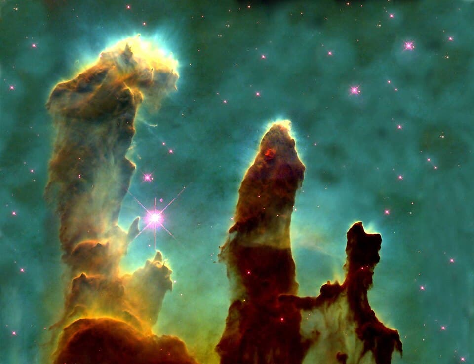 The Pillars of Creation, photographed by the Hubble Space Telescope. Image: NASA/ESA Hubble material, public domain via Wikimedia Commons.
