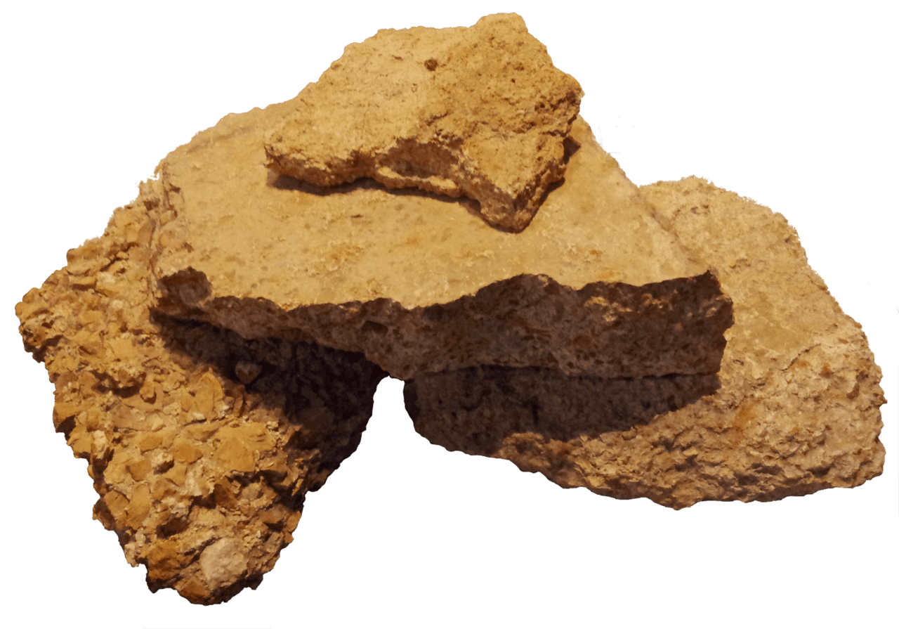 Roman concrete: lime, volcanic ash (pozzolana), and aggregate. The white inclusions are lime clasts — small reservoirs of unreacted material that, recent research suggests, were a deliberate self-healing feature.