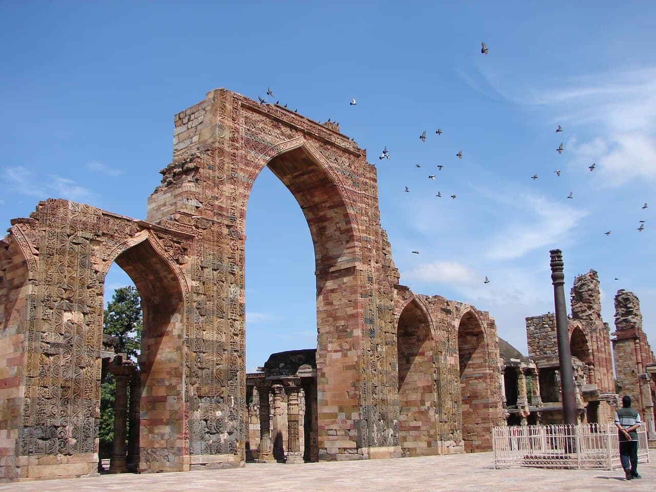 The Qutb complex in southern Delhi. The mosque (1192 onward) was built using stones from demolished temples; the pillar at its centre survived all of that.