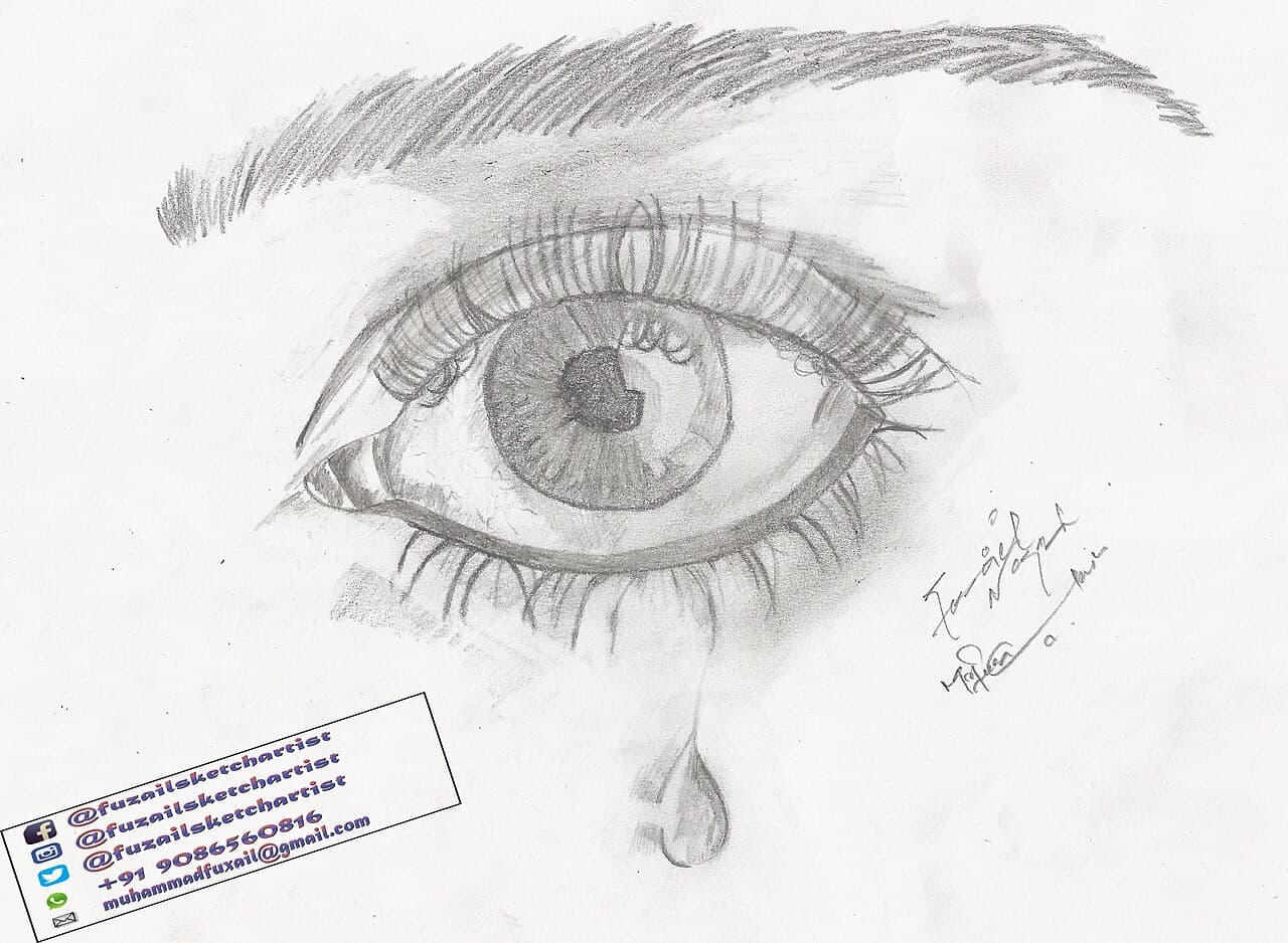 A tear forming. The lacrimal gland produces about a millilitre of basal fluid per day; emotional tears are chemically different.