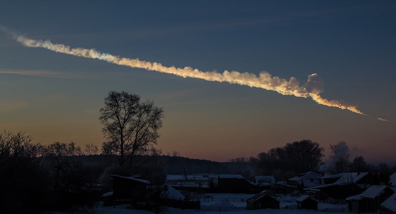 The Chelyabinsk meteor trail, February 2013. About 30 times less energetic than Tunguska; the kind of event a planetary defence programme is calibrated to detect.