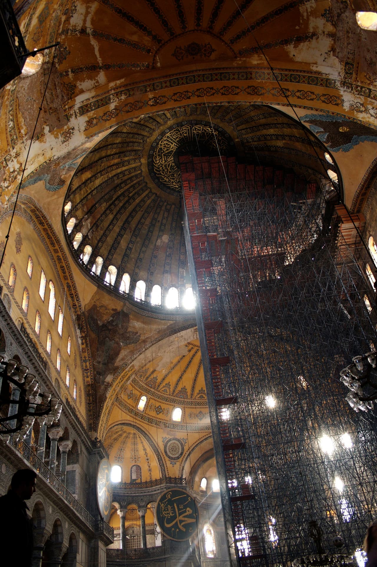 The dome of the Hagia Sophia from below. The ring of windows at the dome's base produces the visual impression that the structure hovers above a band of light.